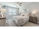 Serene bedroom with neutral tones, plush bedding, ample natural light, and modern decor at 395 S Crow Creek Dr. # 1710, Calabash, NC 28467