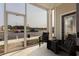Enclosed outdoor patio with seating area and view of the parking lot at 395 S Crow Creek Dr. # 1710, Calabash, NC 28467