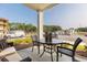 Covered patio with an outdoor seating area and view of construction in the background at 395 S Crow Creek Dr. # 1710, Calabash, NC 28467