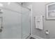 New bathroom with a shower featuring a glass door and white tiled walls at 395 S Crow Creek Dr. # 1710, Calabash, NC 28467