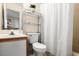 Cozy bathroom featuring a vanity and storage shelves above the toilet at 408 Tree Top Ct. # A, Myrtle Beach, SC 29588