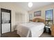 Bright bedroom featuring a double bed, closet and in-unit washer and dryer at 408 Tree Top Ct. # A, Myrtle Beach, SC 29588