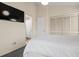 Serene bedroom with ample closet space, a mounted TV, and easy access to an ensuite bathroom at 408 Tree Top Ct. # A, Myrtle Beach, SC 29588