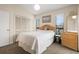 Comfortable bedroom featuring a queen-size bed, bright windows, and a closet for storage at 408 Tree Top Ct. # A, Myrtle Beach, SC 29588