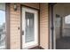 A secure door to the exterior of the home with glass panel to allow light at 408 Tree Top Ct. # A, Myrtle Beach, SC 29588