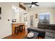Open-concept living space with bar stool seating, a full kitchen view, and access to the bedroom and bathroom at 408 Tree Top Ct. # A, Myrtle Beach, SC 29588