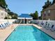 Inviting community pool with clear blue water, sun loungers, and a cabana at 408 Tree Top Ct. # A, Myrtle Beach, SC 29588