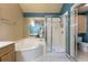 Bathroom with a garden tub, a separate shower, and wood cabinets at 409 65Th Ave. N, Myrtle Beach, SC 29572