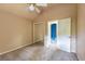 Bedroom with neutral walls, carpet, mirrored closet doors, and view into adjoining blue bathroom at 409 65Th Ave. N, Myrtle Beach, SC 29572