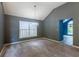 Neutral toned dining room with gray walls, carpet and view into the entryway at 409 65Th Ave. N, Myrtle Beach, SC 29572