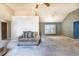 Spacious living room with neutral tones, carpet flooring, and large windows at 409 65Th Ave. N, Myrtle Beach, SC 29572