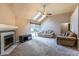 Cozy living room with a fireplace, ceiling fan and sliding door access to the backyard at 409 65Th Ave. N, Myrtle Beach, SC 29572