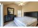 Bedroom featuring a ceiling fan and a mirror on the dresser at 409 65Th Ave. N, Myrtle Beach, SC 29572