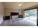 Bright room featuring vaulted ceiling, a ceiling fan, and sliding glass door to the exterior at 409 65Th Ave. N, Myrtle Beach, SC 29572