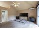 Open bedroom featuring vaulted ceiling, ceiling fan, and ensuite bathroom at 409 65Th Ave. N, Myrtle Beach, SC 29572