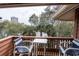 Outdoor balcony featuring comfortable seating and tranquil views of surrounding nature and water at 410 Melrose Pl. # 308, Myrtle Beach, SC 29572