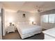 A bedroom featuring neutral decor, a comfortable bed, and a ceiling fan at 410 Melrose Pl. # 308, Myrtle Beach, SC 29572