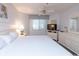 Bright bedroom featuring a large bed, dresser with tv, and natural light from the window at 410 Melrose Pl. # 308, Myrtle Beach, SC 29572