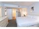 A bedroom with a large bed, ensuite, and closet offers comfort and functionality at 410 Melrose Pl. # 308, Myrtle Beach, SC 29572