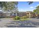 Charming condo complex featuring multiple levels, lush landscaping, and an inviting entrance at 410 Melrose Pl. # 308, Myrtle Beach, SC 29572
