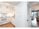 Efficient kitchen layout with white appliances and a pass-through window at 410 Melrose Pl. # 308, Myrtle Beach, SC 29572