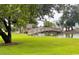 Picturesque park with a charming wooden bridge over a tranquil pond and lush greenery at 410 Melrose Pl. # 308, Myrtle Beach, SC 29572