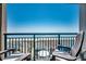 Balcony with seating and railing overlooking the beach and ocean at 4103 N Ocean Blvd. # 304, North Myrtle Beach, SC 29582