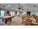 Large, beautifully decorated common room with sofas, pool table, and water views at 4103 N Ocean Blvd. # 304, North Myrtle Beach, SC 29582