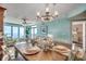 Bright coastal dining room with wooden table, chandelier, and ocean view at 4103 N Ocean Blvd. # 304, North Myrtle Beach, SC 29582