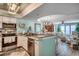 Bright, open kitchen with stainless steel appliances, granite countertops, and an ocean view at 4103 N Ocean Blvd. # 304, North Myrtle Beach, SC 29582