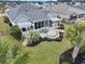 Aerial view of a landscaped backyard featuring a patio with a fire pit and entertainment space at 419 Broadmoor Dr., Murrells Inlet, SC 29576