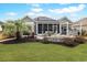 Spacious backyard featuring a fire pit, patio, and lush landscaping at 419 Broadmoor Dr., Murrells Inlet, SC 29576