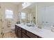 Bathroom with double sinks, vanity, and large mirror at 419 Broadmoor Dr., Murrells Inlet, SC 29576