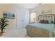 Bedroom with neutral walls, a bed, closet and painting at 419 Broadmoor Dr., Murrells Inlet, SC 29576