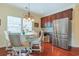 Bright breakfast nook featuring a table set, stainless steel fridge, and ample storage for relaxed dining experiences at 419 Broadmoor Dr., Murrells Inlet, SC 29576