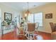 Cozy breakfast nook with a round table, chandelier, and windows offering natural light and pleasant views at 419 Broadmoor Dr., Murrells Inlet, SC 29576