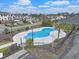 A kidney-shaped community pool with an American flag at 419 Broadmoor Dr., Murrells Inlet, SC 29576