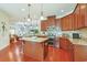 Spacious kitchen with cherry cabinets, granite countertops, stainless steel appliances, and center island for cooking at 419 Broadmoor Dr., Murrells Inlet, SC 29576