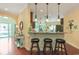 Open kitchen bar with granite countertop, pendant lighting, and comfortable seating for casual dining and entertaining at 419 Broadmoor Dr., Murrells Inlet, SC 29576
