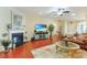 Inviting living room with a cozy fireplace, elegant decor, and warm wood floors that create an inviting atmosphere at 419 Broadmoor Dr., Murrells Inlet, SC 29576