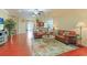 Expansive living area with hardwood floors, comfortable seating, and ample natural light, perfect for relaxation and entertaining at 419 Broadmoor Dr., Murrells Inlet, SC 29576