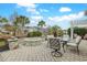 Inviting outdoor patio featuring comfortable seating, a fire pit, and lush landscaping, great for relaxing at 419 Broadmoor Dr., Murrells Inlet, SC 29576