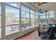 Sunroom with windows, patio view, hardwood floors, and ceiling fan at 419 Broadmoor Dr., Murrells Inlet, SC 29576