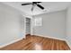 Bedroom with ceiling fan, hardwood floors, and closet space at 4320 Stevens St., Loris, SC 29569
