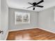 This bedroom features hardwood floors, ceiling fan, and large windows for natural light at 4320 Stevens St., Loris, SC 29569