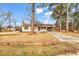Ranch home with mature trees, brick, and a lawn at 4320 Stevens St., Loris, SC 29569