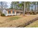 Ranch style home with mature trees, lawn, and brick at 4320 Stevens St., Loris, SC 29569