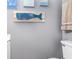 Charming bathroom featuring a whale decoration and coastal themed wall art at 4350 Intercoastal Dr. # 1404, Little River, SC 29566