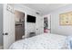 Comfortable bedroom showing entry to bathroom, TV, closet, coastal decor at 4350 Intercoastal Dr. # 1404, Little River, SC 29566