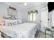 Comfortable bedroom with starfish-themed bedding, beach pillows, and stylish decor at 4350 Intercoastal Dr. # 1404, Little River, SC 29566